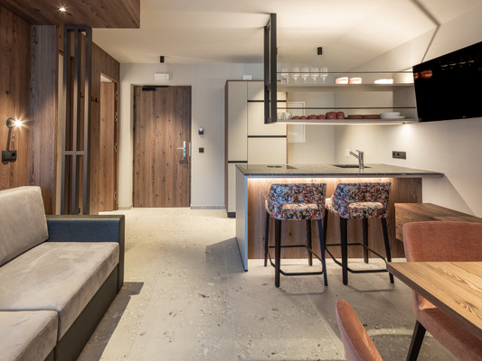 La zona giorno Corones Suites - Dolomites Residence