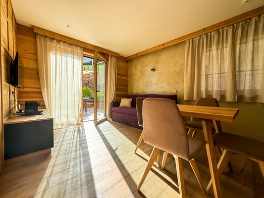 La zona giorno Vivi Suites&Spa - Boutique Guest House Molveno