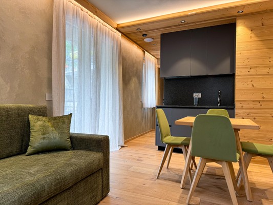 La zona giorno Vivi Suites&Spa - Boutique Guest House Molveno