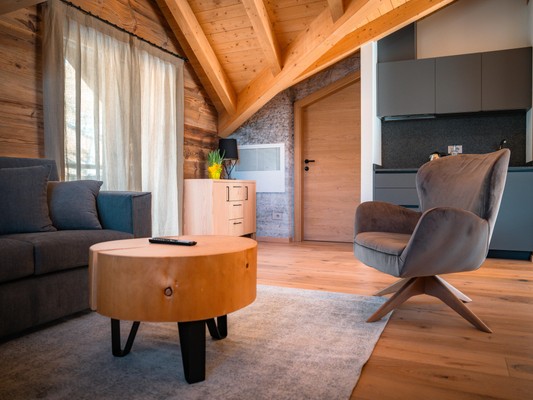 La zona giorno Vivi Suites&Spa - Boutique Guest House Molveno
