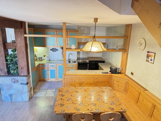 La zona giorno Appartamento La Marmotta - Family Home