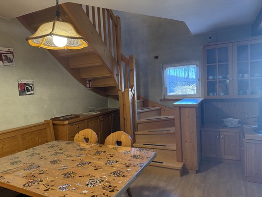 La zona giorno Appartamento La Marmotta - Family Home