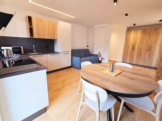 La zona giorno Appartamento Alpine Lodge Tesero