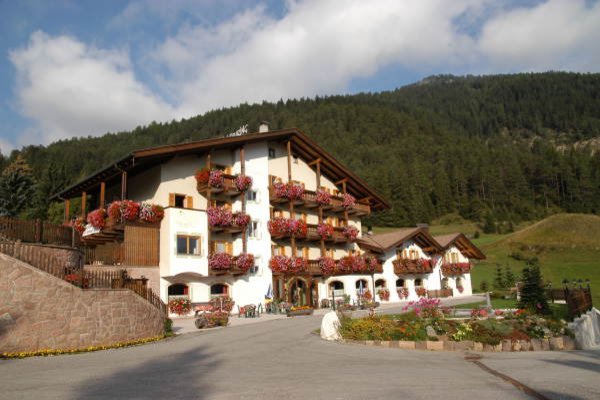 Photo exteriors in summer Alpine Touring Hotel