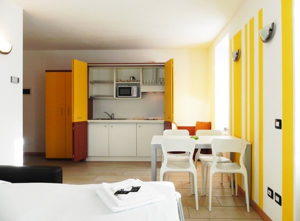 La zona giorno Acero Rosso - Residence 3 stelle
