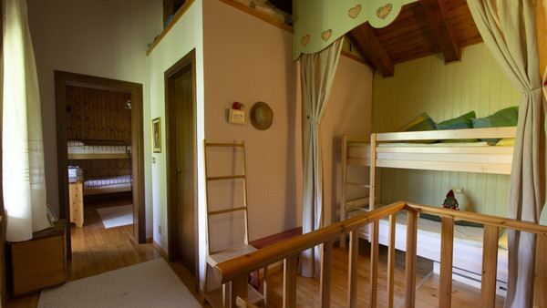 Foto vom Zimmer Ferienhaus Chalet Martignilas - La casa nel bosco