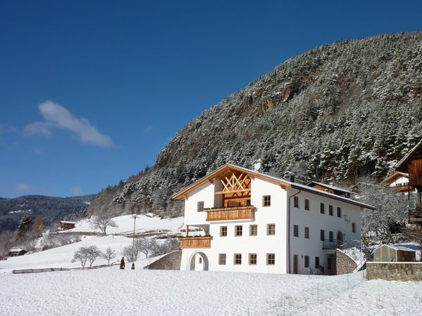 Foto invernale di presentazione B&B + Appartamenti in agriturismo Paalhof