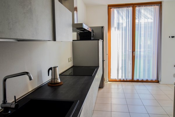 Foto der Küche Komodo Apartments