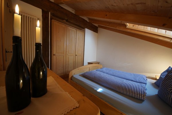 Foto vom Zimmer Ferienwohnungen auf dem Bauernhof Osteria Plazores - rustic sleep