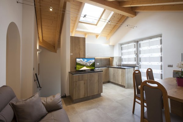 La zona giorno Fiemme Home Mountain Apartment