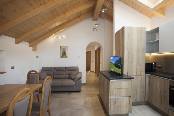 La zona giorno Fiemme Home Mountain Apartment